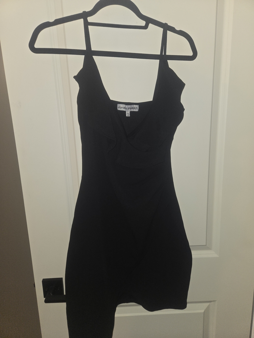 Black Sleeveless Ruffle Front Dress
